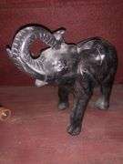Various Decorative Items Including Faux Flower, Skull Wall Piece, Stick Dummy, 2 Head Figurines, Elephant Statue, 2 Antelope Statues, Golden Pumpkin, and Bird with Crown Statue