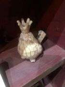 Various Decorative Items Including Faux Flower, Skull Wall Piece, Stick Dummy, 2 Head Figurines, Elephant Statue, 2 Antelope Statues, Golden Pumpkin, and Bird with Crown Statue