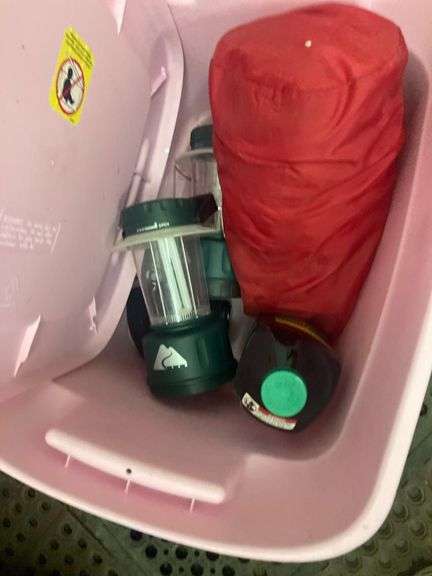 Bin with Various Outdoor Items Including Sleeping Bag, Battery Lamps, Hot Dog Sticks, Marshmallow Sticks, Burger Cookers, and Rope
