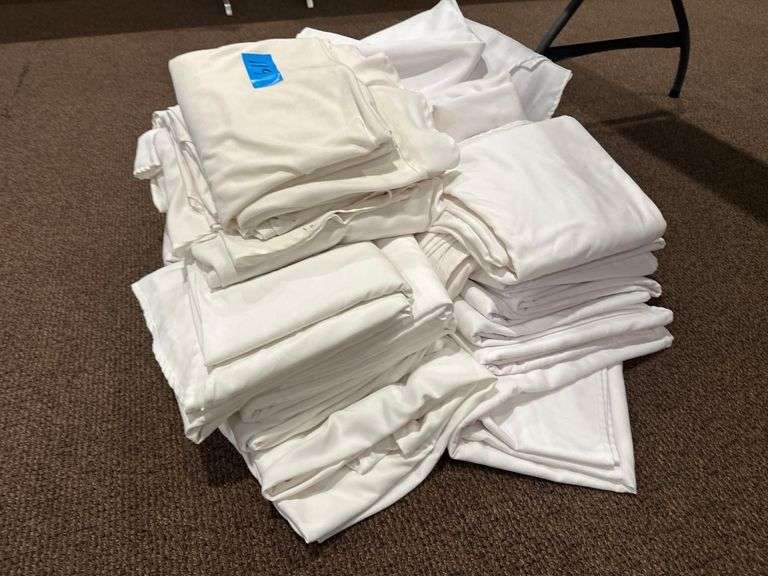 Large Pile of Tablecloths and Linens