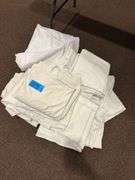 Large Pile of Tablecloths and Linens