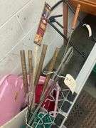 Bin with Various Outdoor Items Including Sleeping Bag, Battery Lamps, Hot Dog Sticks, Marshmallow Sticks, Burger Cookers, and Rope