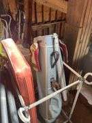 An Abundance of Vintage Items 24 x36 Ceiling Tiles, 2 Footballs, Silk Poinsettia Lights, 3 Ceiling Lights New in Boxes, Golf Bag, Large Cord Wood Ring 43 Inches