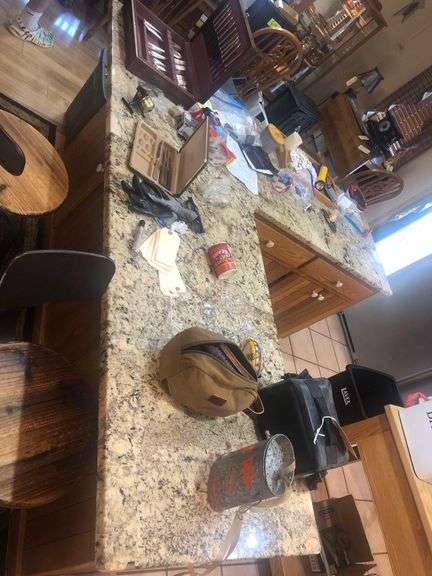 All Contents on Table Including Camera, Silverware, Candle, Lighters, Shoe Polishing Kit and Daiwa Fishing Reel image