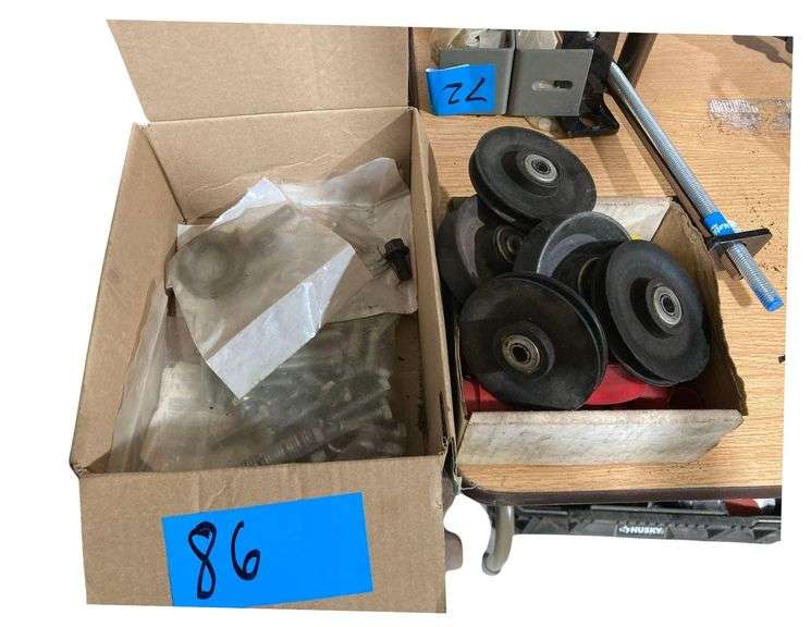 Lot of Bolts, Washers, and Assorted Sized Pulleys image