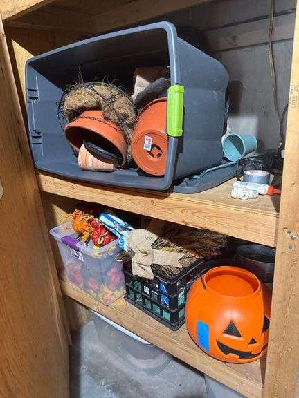 Contents of Cabinet including Halloween Decor, Christmas Wreath image