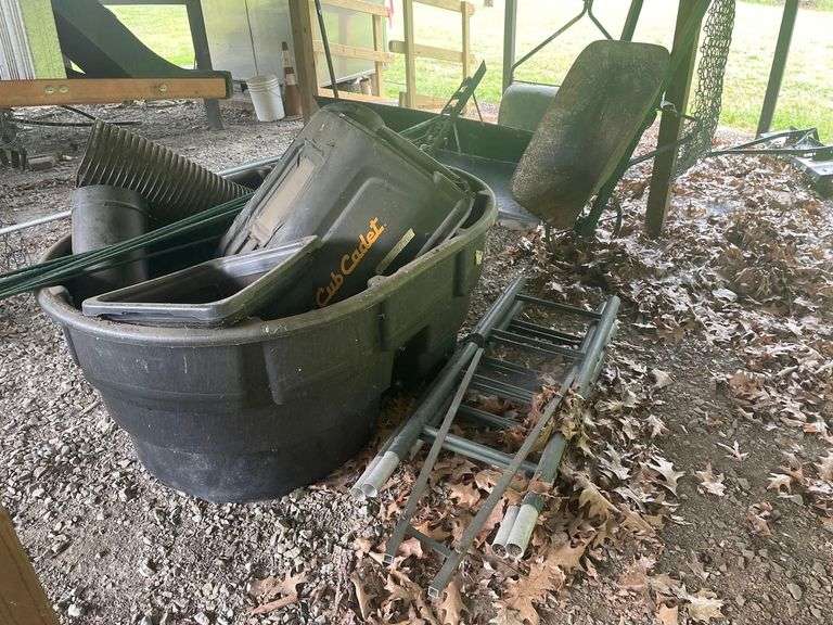 Vintage Wheel Barrow 12 Foot Ladder Rubbermaid Tub 56x39x24 Inches and Some Cub Cadet Lawn Tractor Parts image