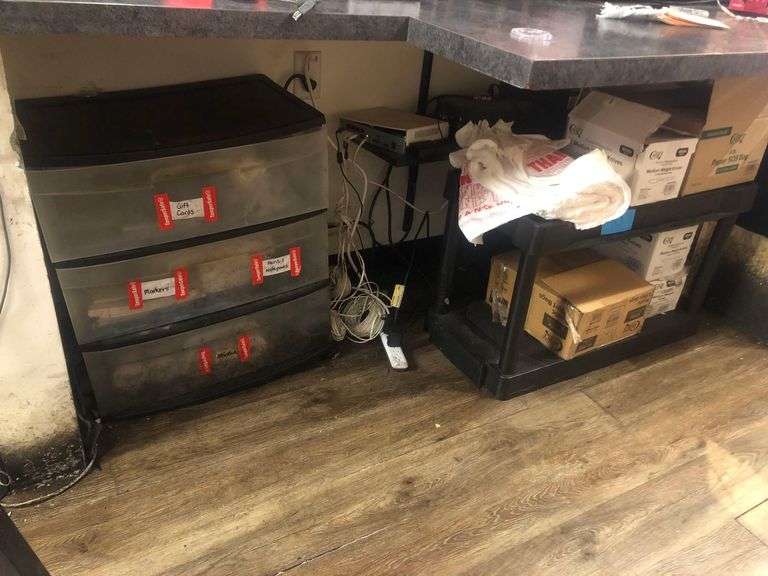 (2) Storage Shelves With Contents Including Notebooks, Plastic Utensils, Bags, And Miscellaneous image