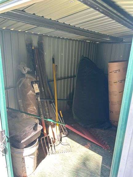 Contents of Shed, Left Side - Rakes, Buckets, Tent, etc image