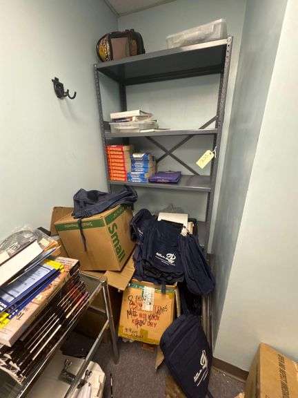 Storage Rack Containing Boxes of Triangle Tech Bags, Various Dictionaries, Welding Mask, Etc. image