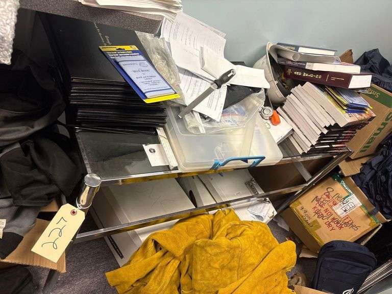 Glass Table Containing Books, Folders, Other Miscellaneous Items image