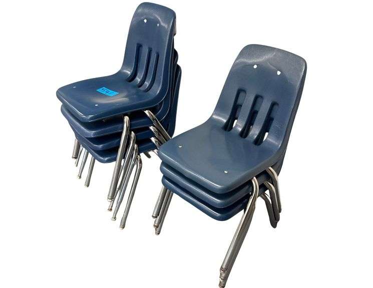 Seven Plastic Chairs image