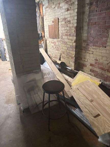 Contents of Room - Clear Plastic Hinged Dividers - Plywood Scraps - GE Bulbs - Commercial Rugs - Rubber Wall Base image