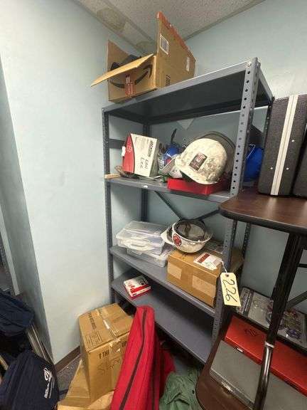 Storage Rack Containing Construction Hats, Welding Masks, Measuring Tools, Etc. image