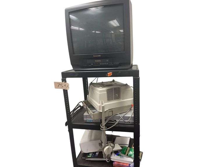 Panasonic TV Model no.PV-C2023, An Apolla Overhead Projector 483B a DVD Player by insignia all on a AV Cart image