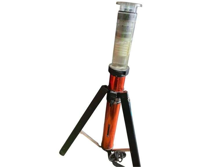 A Portable Saw Horse 40 Inches Wide with a Portable Electric Work Light 44 Inches Tall image