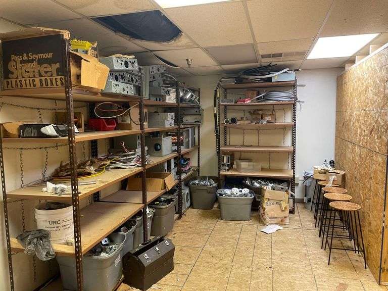 Contents of Room 4 Metal Shelfs 48x24x74 Inches with Used Breaker Boxes Aluminum wire and Copper 5 Wicker Top Stools image
