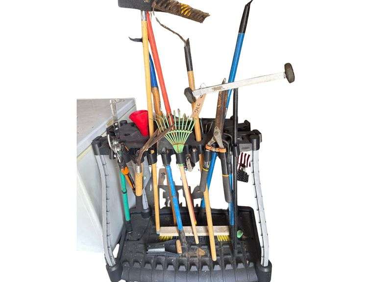Organizer Rack and All Tools Hanging On It Including Rakes, Pitch Fork, Shears, Pruning Shears and etc. image