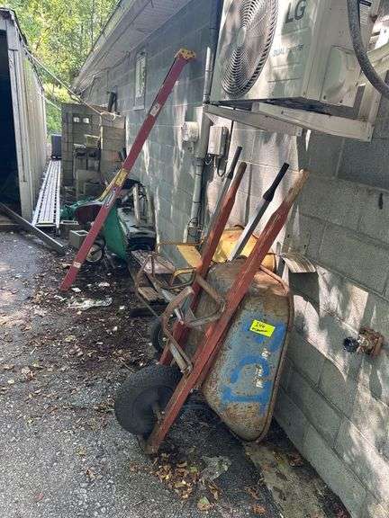 All Contents Between Trailer & Building Including Shingles - Ladder - wheelbarrow’s - Cinder Blocks image