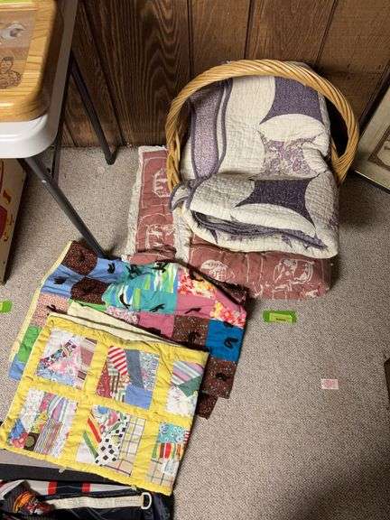 A basket of quilts and comforters image