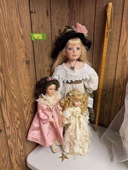Three bisque porcelain dolls image