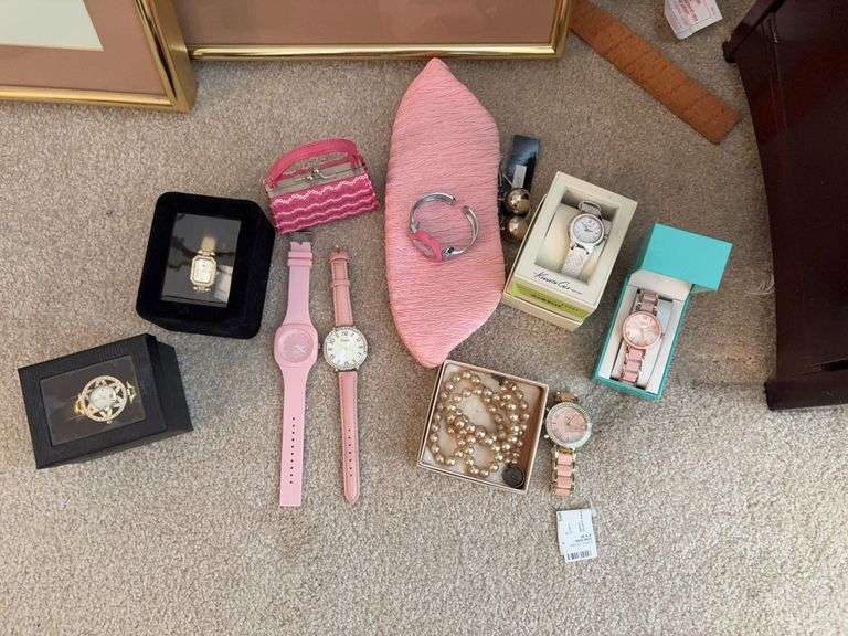 Women’s watches including Kenneth Cole, Figaro Couture, a strand of pearls and a pink clutch image