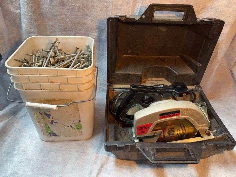 Lot consisting of approximately 3 gallon pail of aluminum 7-in gutter nails, Senco roofing nailer nearly full box of nails (1-1/2 in 15 deg wire collated, galvanized) Craftsman circular saw in case. image