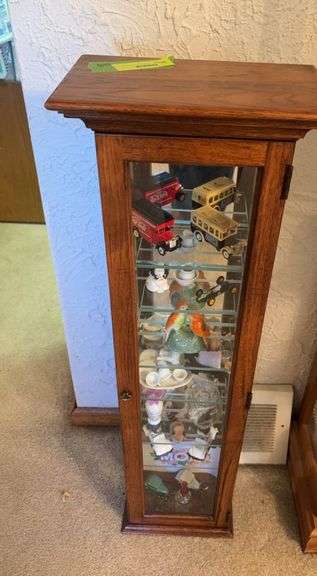 6x11x35H small curio cabinet with various tchotchkes image