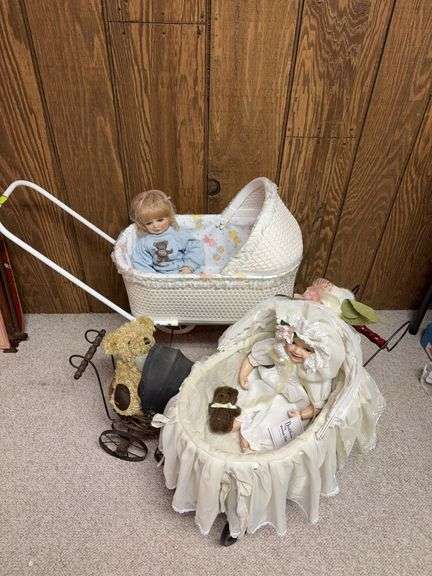 Three baby buggies with passengers image