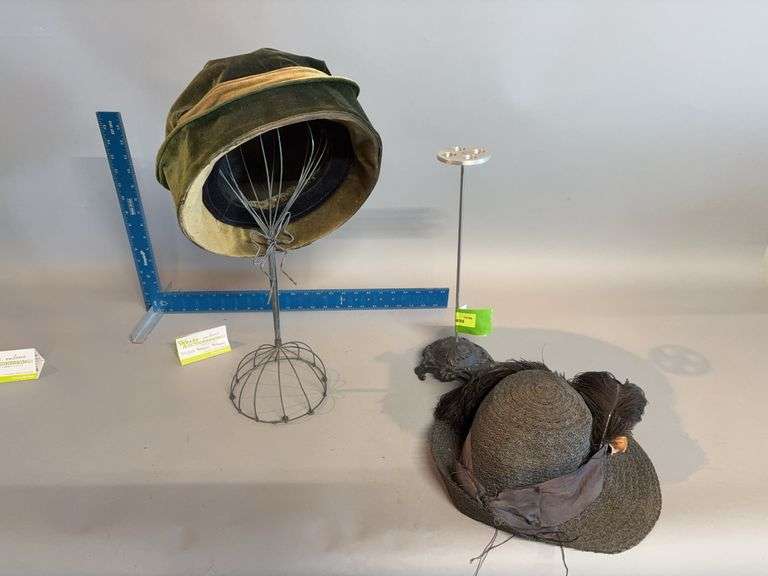 Two hat stands and ladies hats image