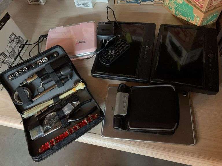 Three portable dvd players, incomplete roadside tool kit, three Samsung phones, Samsung tablet, etc image