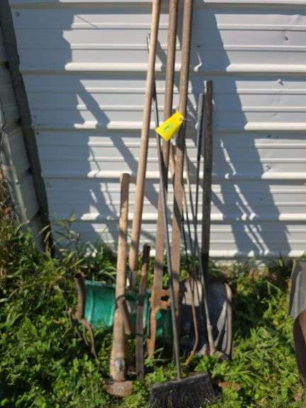 Various long handled yard tools