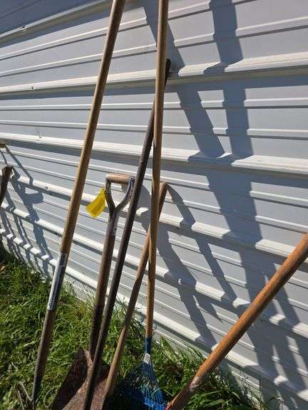 Various long handled yard tools