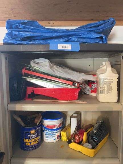 Painting supplies and tarp