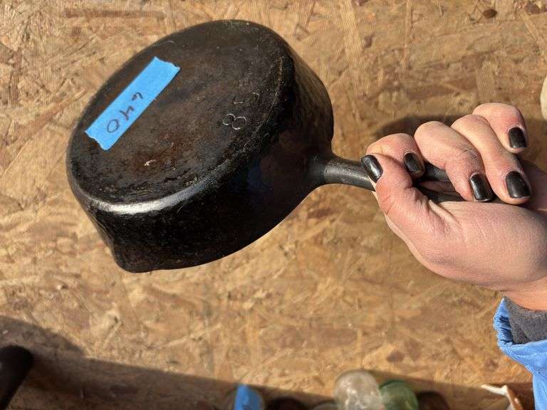 Hammered cast-iron skillet marked 85E