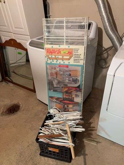 NEW Rafter Solutions hanging storage shelves, a box of clothes hangers and rod of clothes hangers image