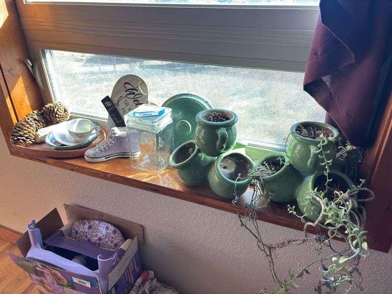 Two green ceramic planters and additional decor items
