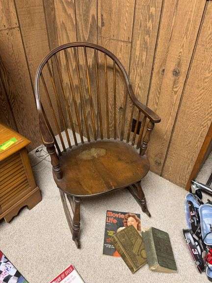 Spindle back rocking chair w vintage reading material image
