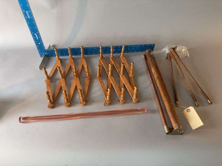 4 wooden towel hangers and an 18” long pink glass towel holder w flaw in glass image