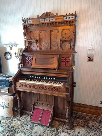 Walnut Eastlake style pump organ with spoon carved back image