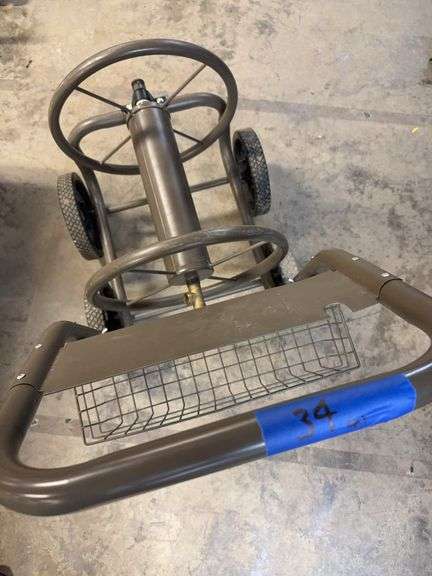 Large wheeled hose reel, garden hose, garden edging, bulb planter, weeder, scraper, roof rake for snow, sit or kneel bench. image