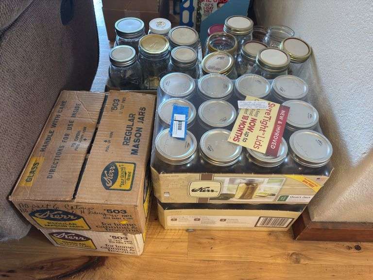 Four new unopened boxes of canning jars plus additional used jars