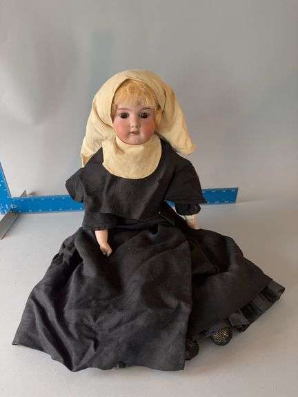 Circa 1940’s bisque nun doll w sleep eyes and  original habit image
