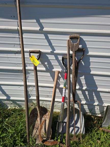 Various long handled yard tools