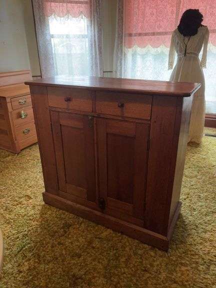 Walnut cupboard base with two drawers with square cut nails  and latching double doors 17D x 41L x 38H image