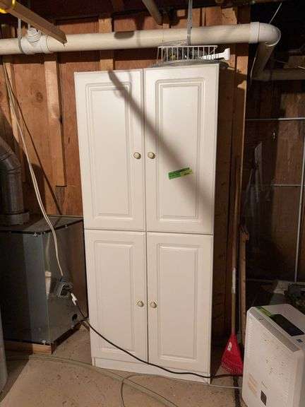 16D x 30L x 72H four door cabinet and contents shown image