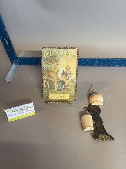 DeLaval chain frame advertising “The Frank Lynch Co” and DeLaval match keeper image