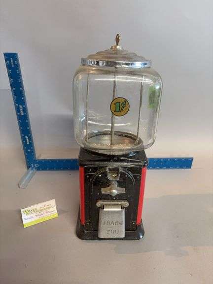 Penny candy dispenser w/ key 18” tall approx. has money in it 😳 image