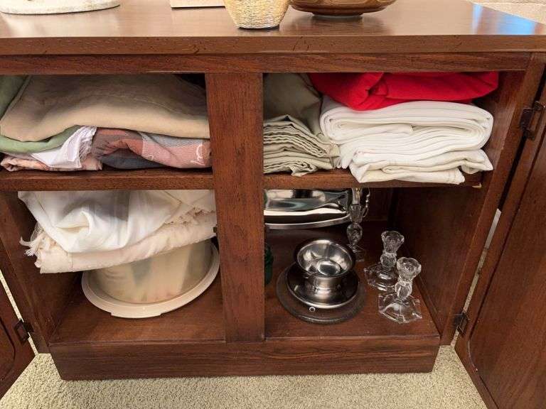 Table cloths, table runners, candlestick holders, various candles, etc image