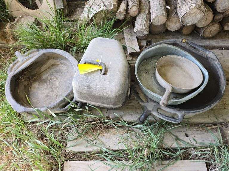 2 oil drain pans, chainsaw case and hog pan